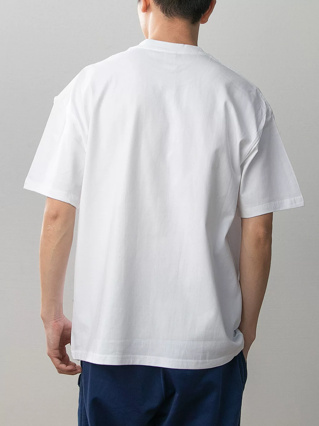 White Goku and Chi-Chi cotton T-shirt model rear view showing plain white back