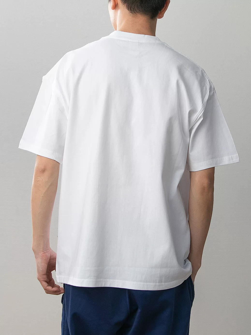 White Goku and Chi-Chi cotton T-shirt model rear view showing plain white back