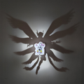Gatomon-inspired Digimon shadow lamp illuminated on wall and casting a large mult-winged anime silhouette