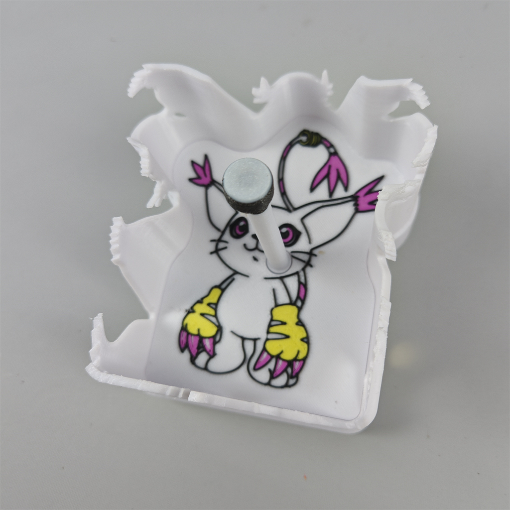 Close view of the Gatomon-inspired shadow light with white cat character, purple eyes, pink ears, yellow clawed paws