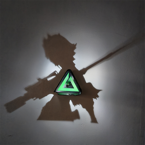 Warrior anime shadow projection lamp creating a large two-weapon fighter silhouette on a wall with a glowing green geometric triangle at its center