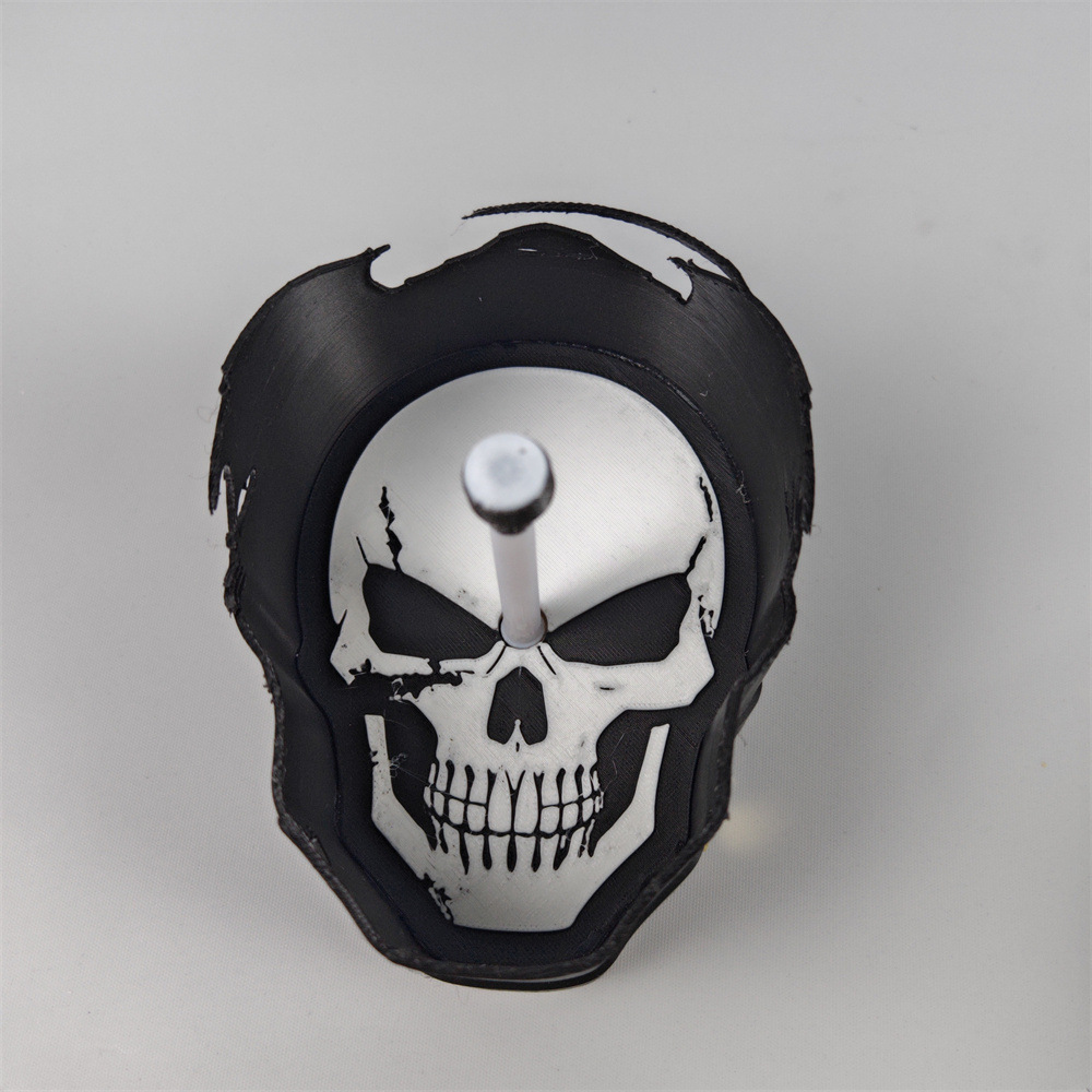 Close-up skull design and sculpted black housing of the Grim Reaper shadow projection lamp
