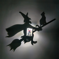 Halloween witch and black cat shadow lamp projecting a witch flying on a broomstick with a cat silhouette on the wall