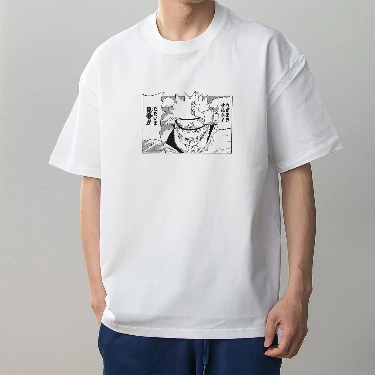 Naruto Uzumaki white cotton graphic T-shirt on model, front view with black manga-panel print