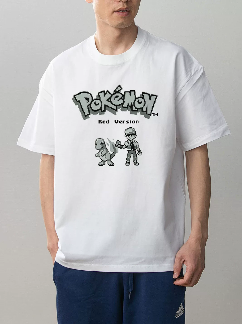 Pokémon Red Version white cotton T-shirt on model, front with retro pixel Trainer Red and Charmander design