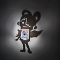 Uta-inspired One Piece shadow projection lamp casting a large anime singer silhouette on a wall around a colorful Red Uta Live WANTED poster